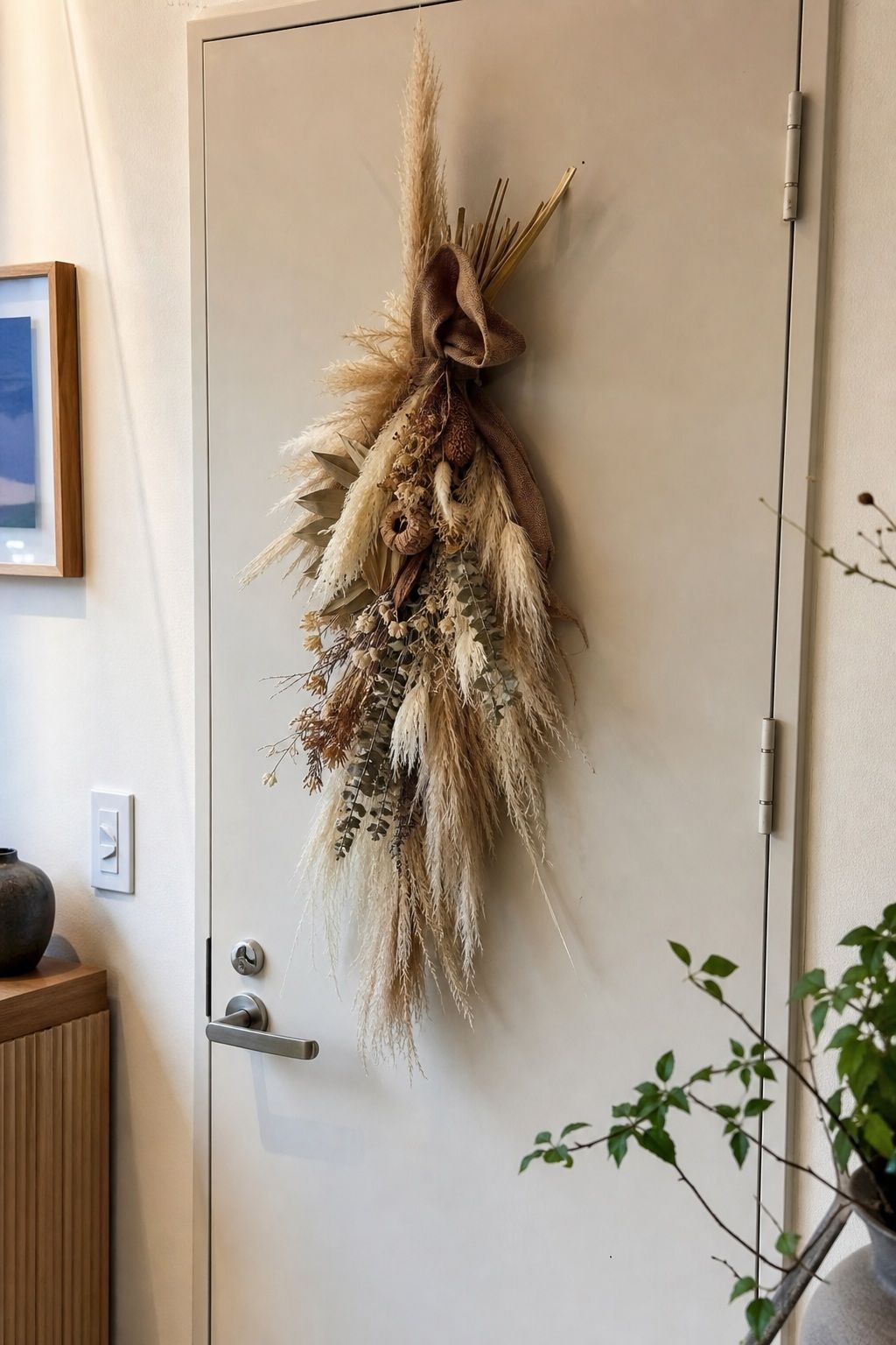 A Pampas Grass and Dried Floral Swag small apartment idea for Top 17 Door Summer Decor Ideas for Small Apartments.