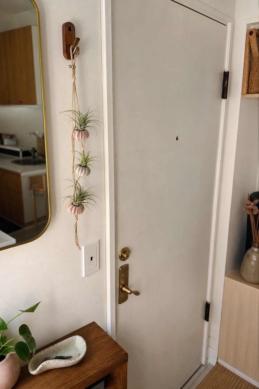 A Small Hanging Air Plant Cluster small apartment idea for Top 17 Door Summer Decor Ideas for Small Apartments.