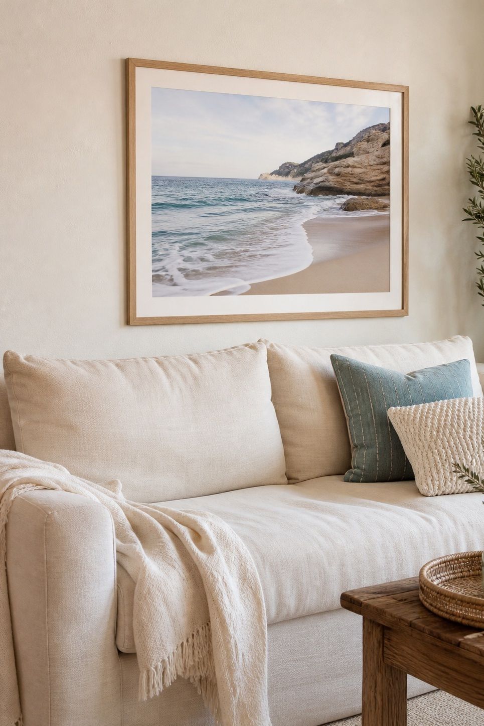 A Framed Coastal Print Above the Sofa small apartment idea for Top 20 Beach House Interior Ideas for a Small Apartment Refresh.