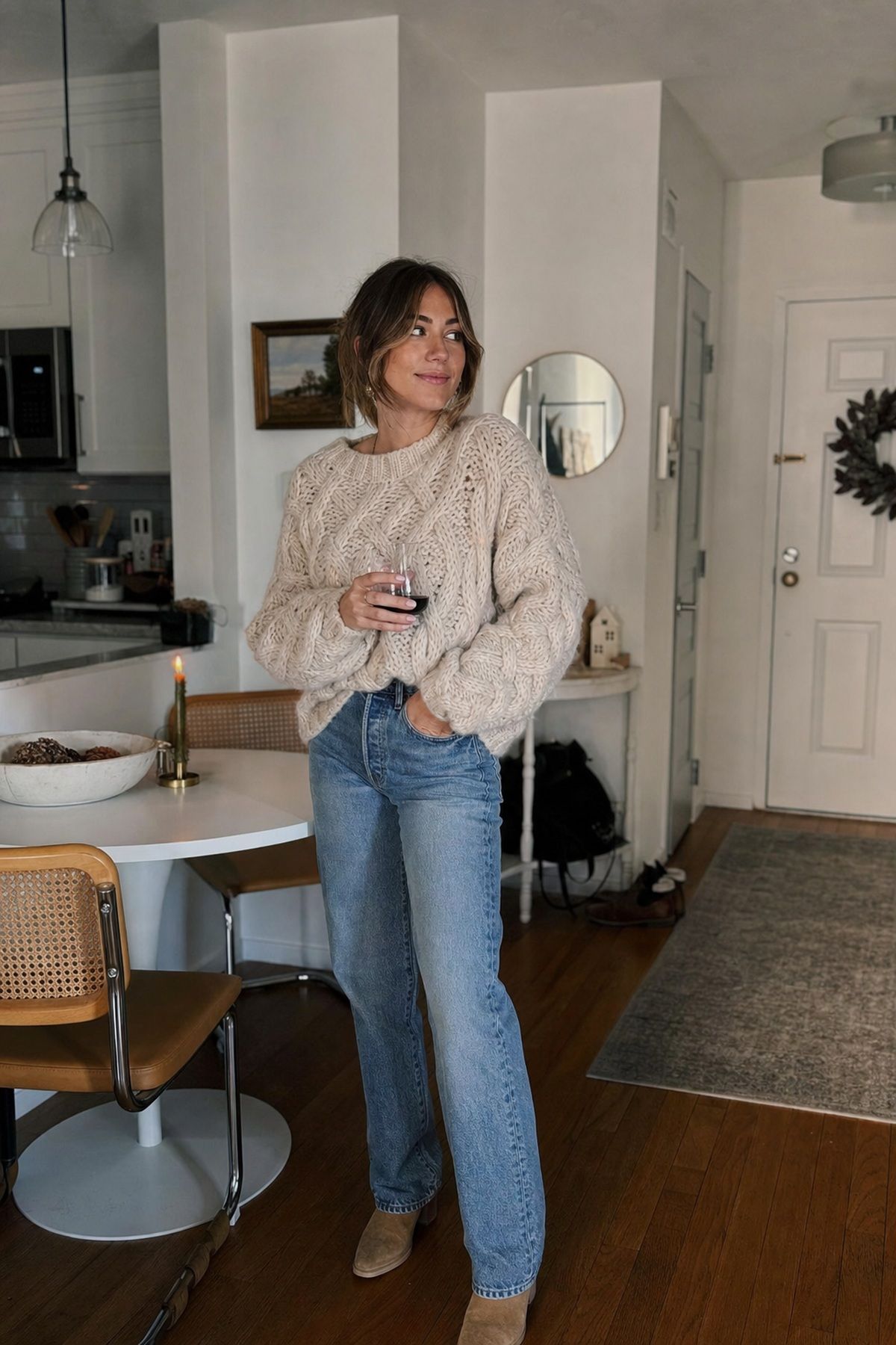 A Chunky Knit With Good Jeans small apartment idea for Top 16 Friendsgiving Outfit Ideas for a Cozy, Chic Look.