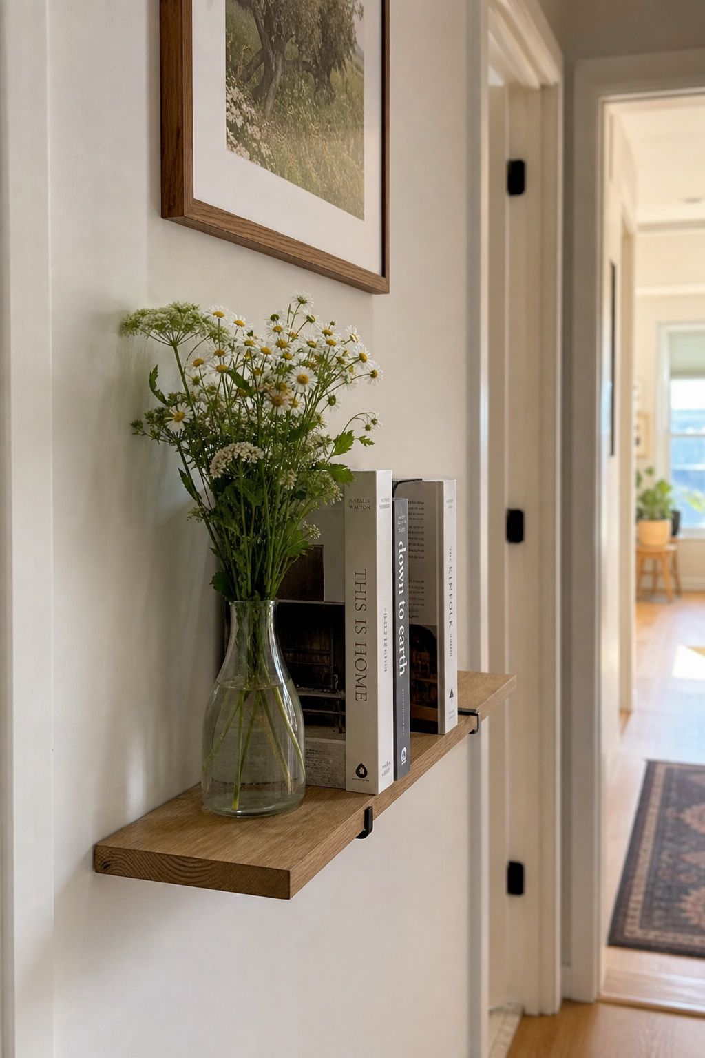 A Slim Floating Shelf for Florals and Books small apartment idea for Top 16 Hallway Summer Decor Ideas for Small Apartments.