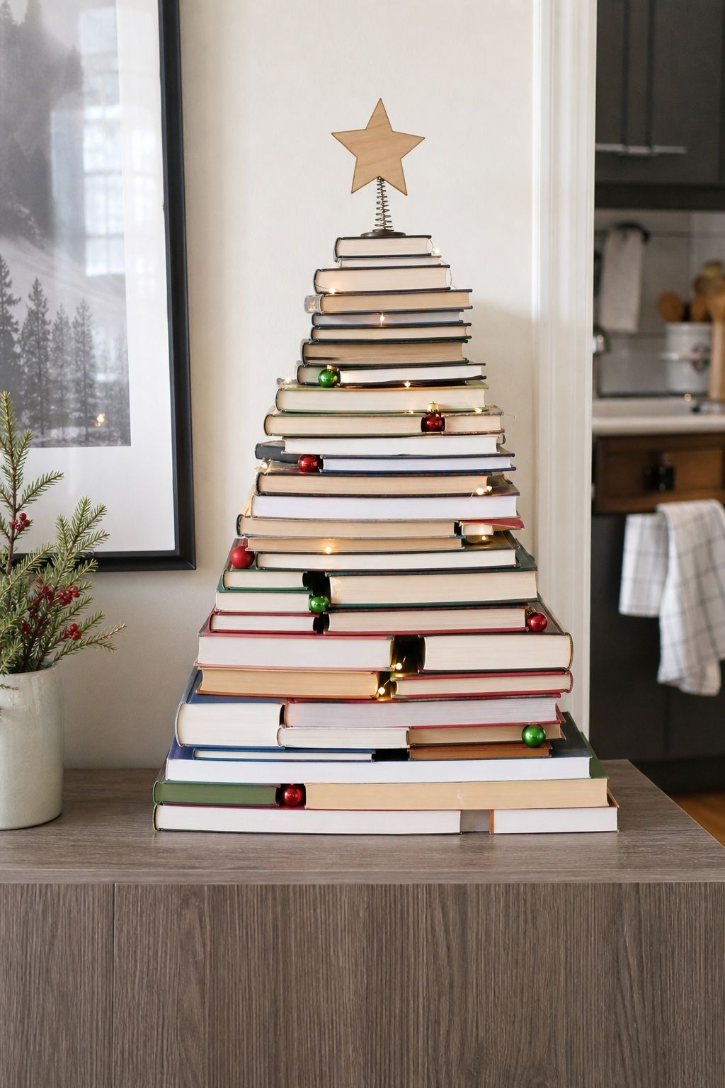 Stack Books in a Triangle Shape and Add a Star small apartment idea for Top 17 Small Apartment Christmas Tree Ideas When You Have No Floor Space.