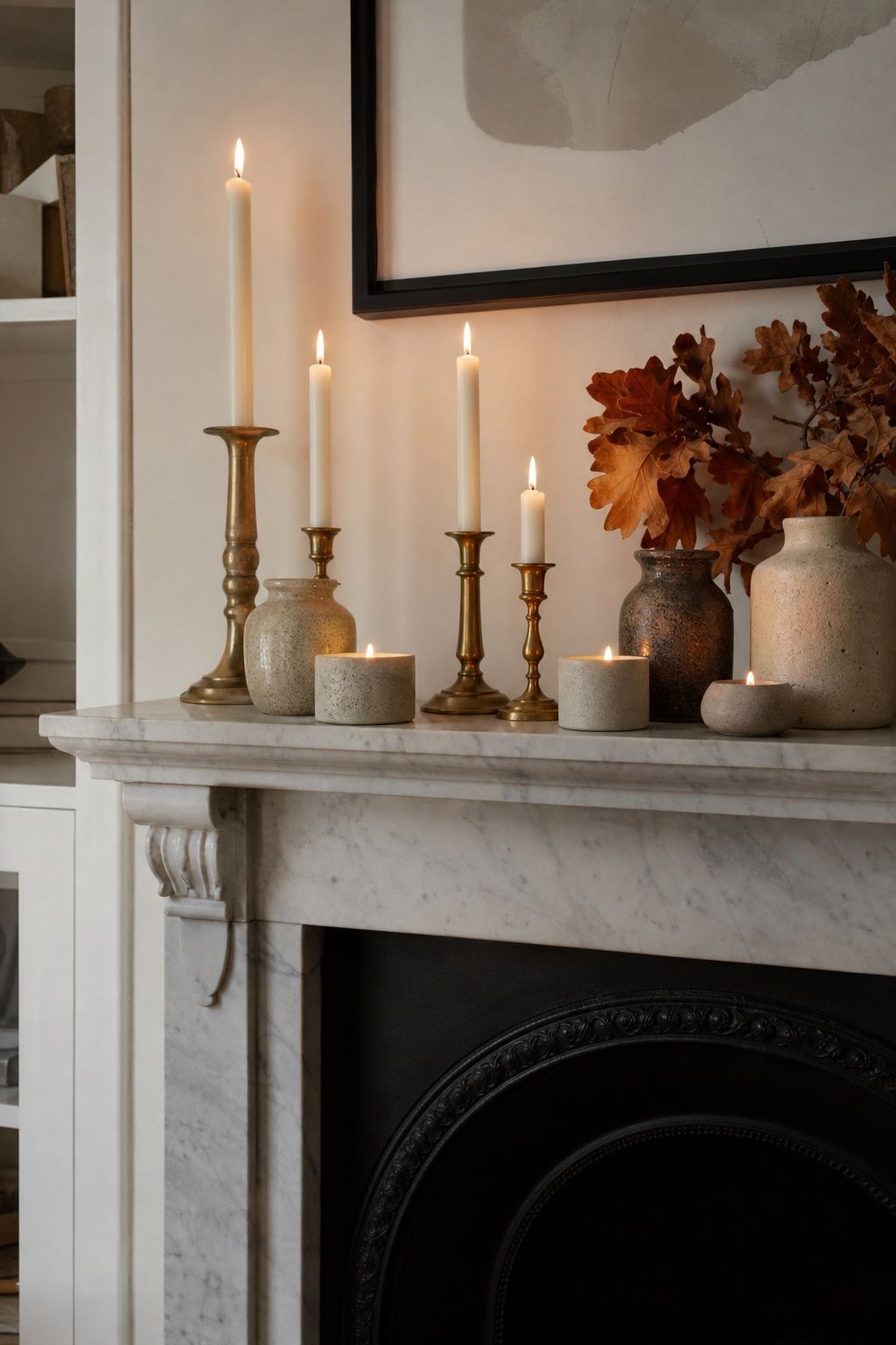 Cluster Brass and Stoneware Candles on the Mantel small apartment idea for Top 18 Autumn Decor for Fireplaces in Small Spaces.