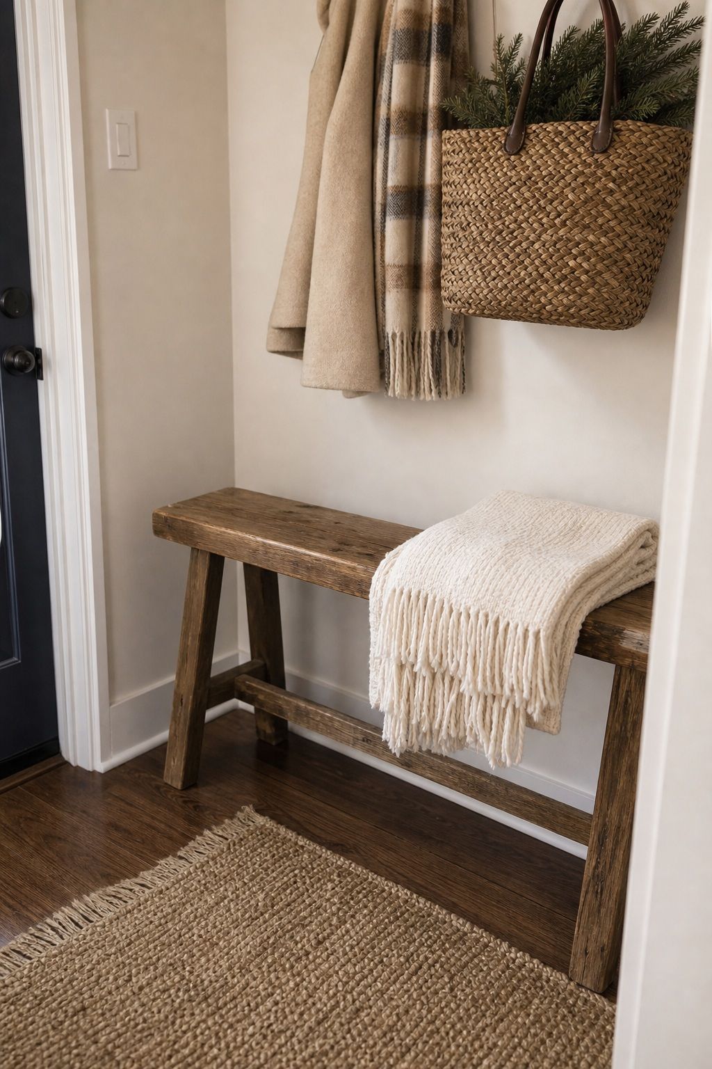 Add a Wooden Bench With a Folded Throw small apartment idea for Top 18 Winter Farmhouse Decor Ideas for Small Apartments.