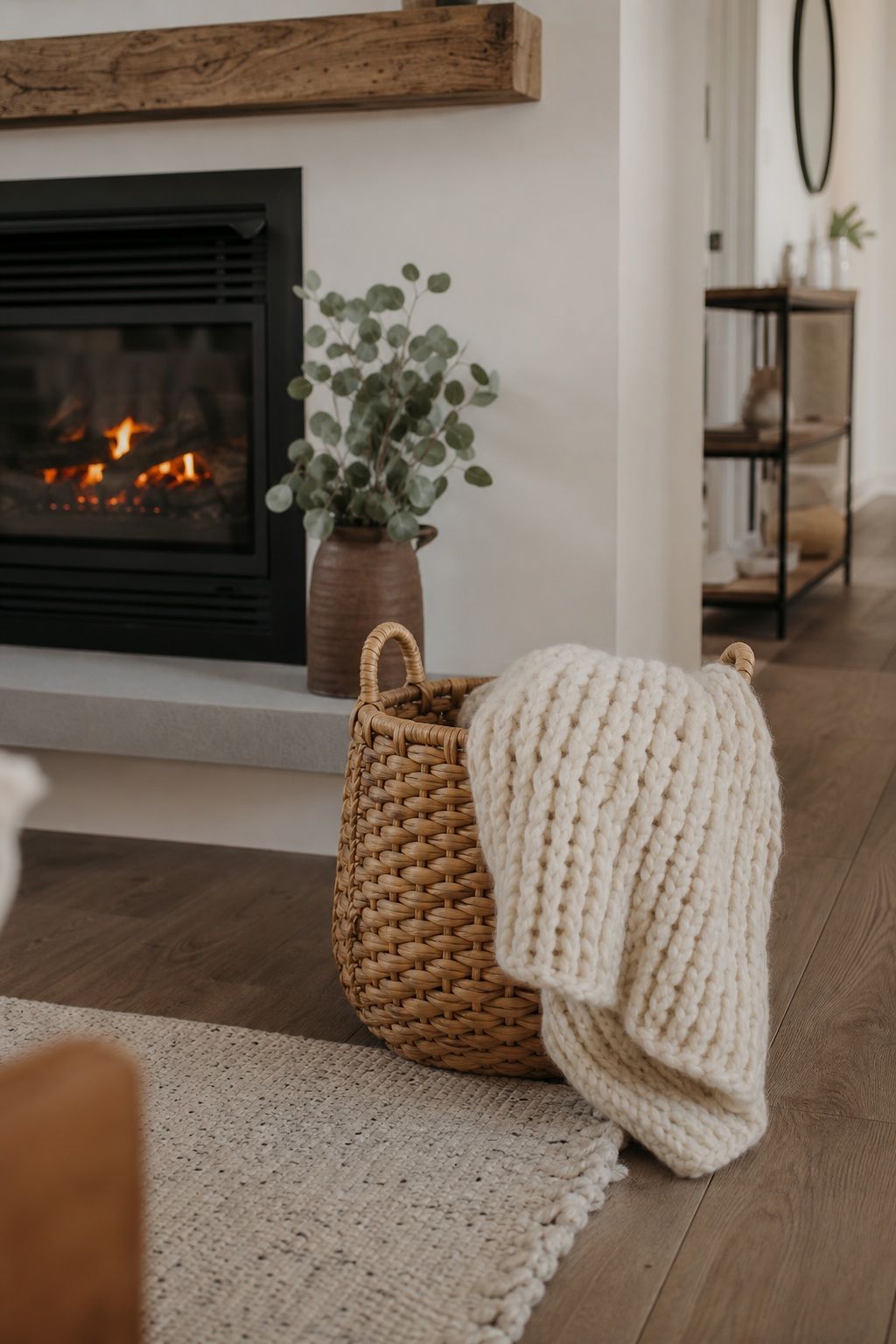 Add a Cozy Throw and Basket Beside the Fireplace small apartment idea for Top 17 Winter Fireplace Decor Ideas for Small Spaces.