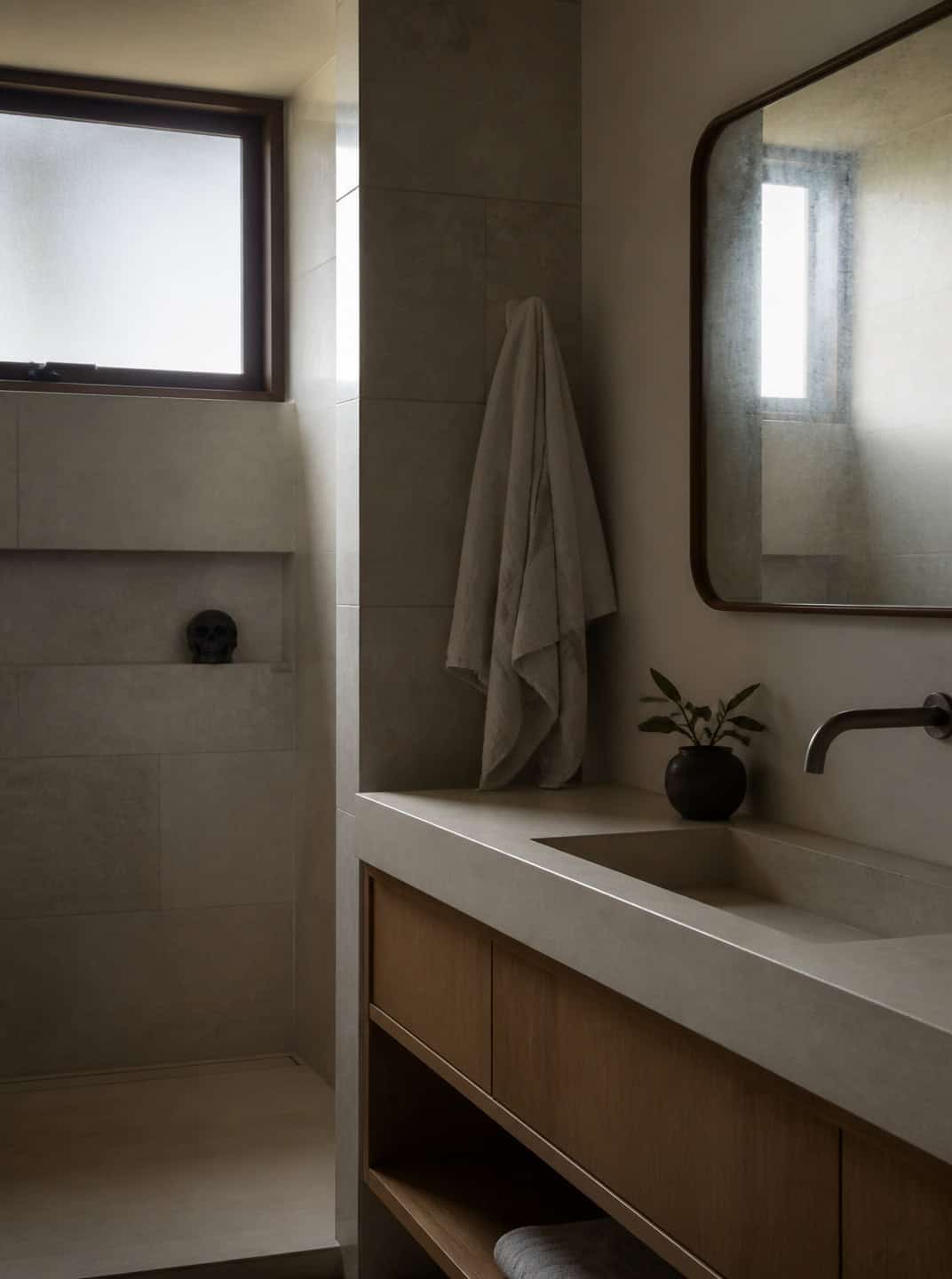 Modern bathroom with a small skull decoration, offering a subtle Halloween touch.
