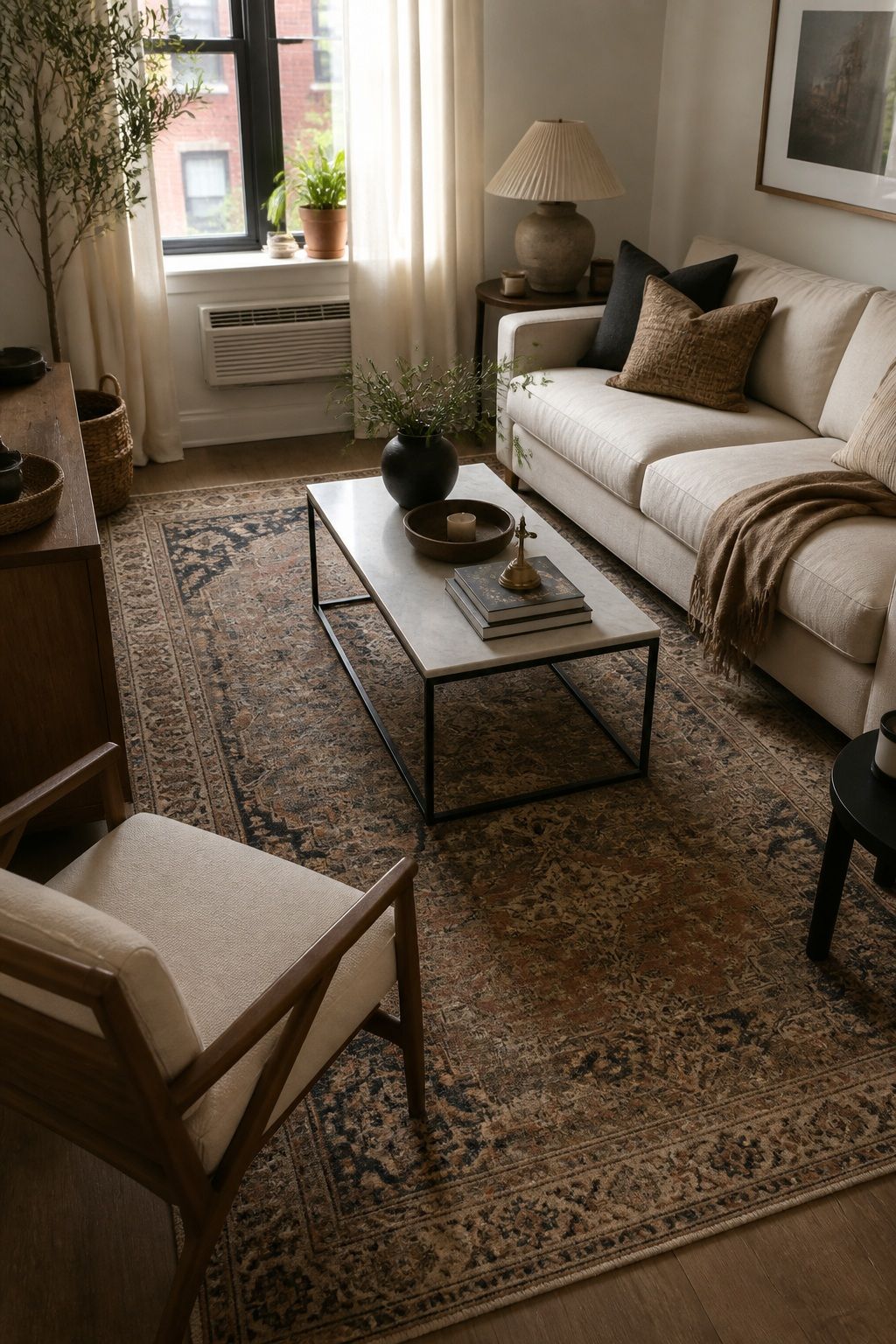 Anchor with a Vintage Rug small apartment idea for Top 18 Apartment Style Ideas That Make Your Space Feel Intentional.