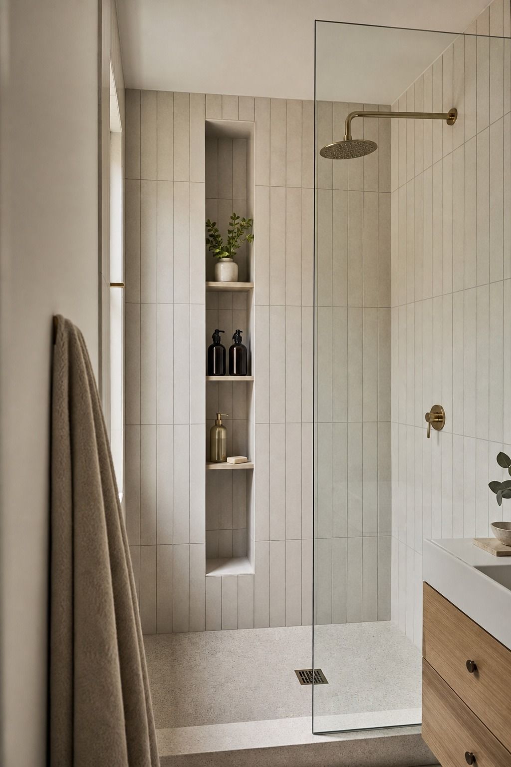 Vertical Stacked Tile With a Tall Niche small apartment idea for Top 17 Shower Tile Combinations That Make a Small Bathroom Feel Bigger.