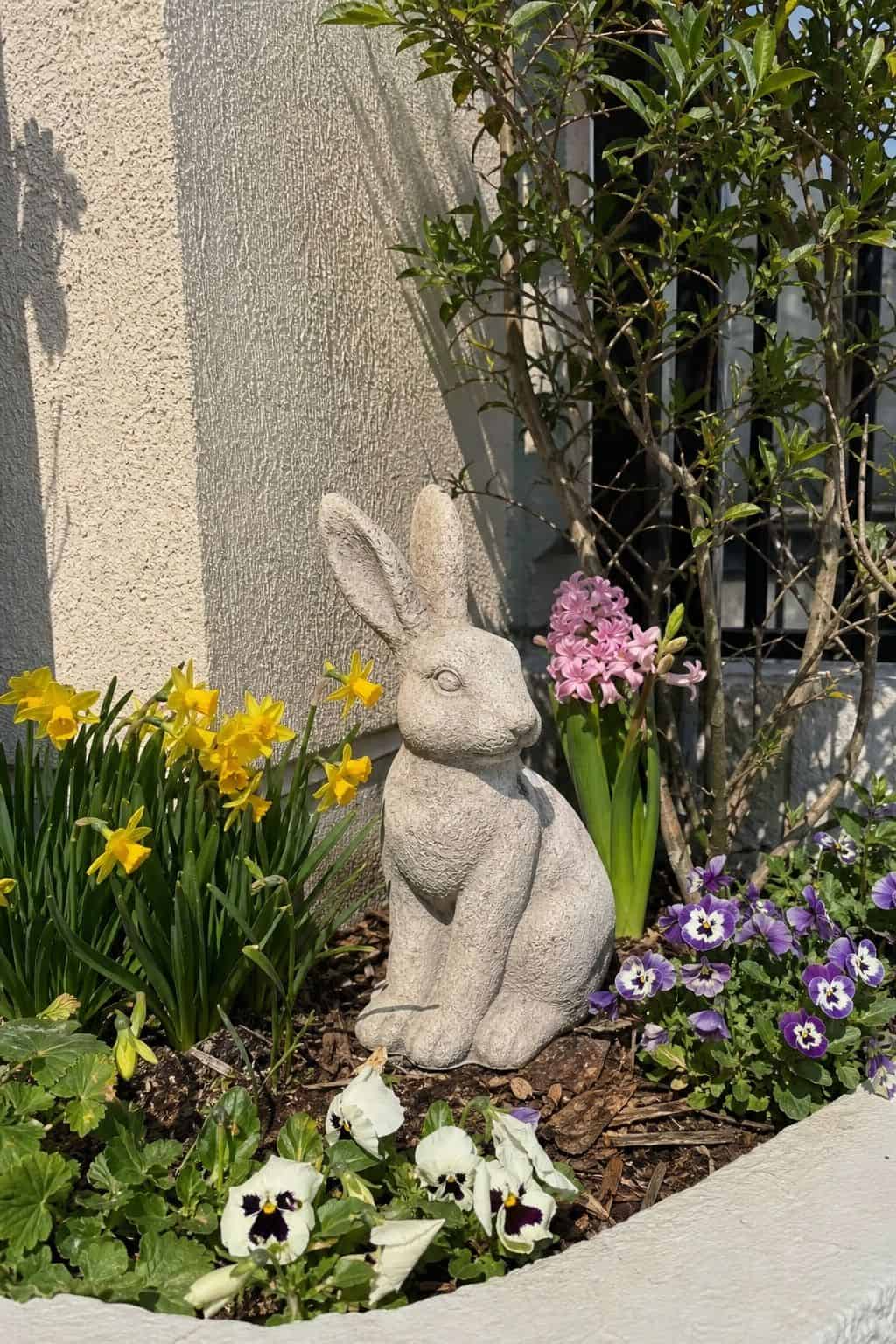 Place an Easter Bunny Garden Statue small apartment idea for Top 16 Easter Outdoor Decoration Ideas for Every Part of Your Home.