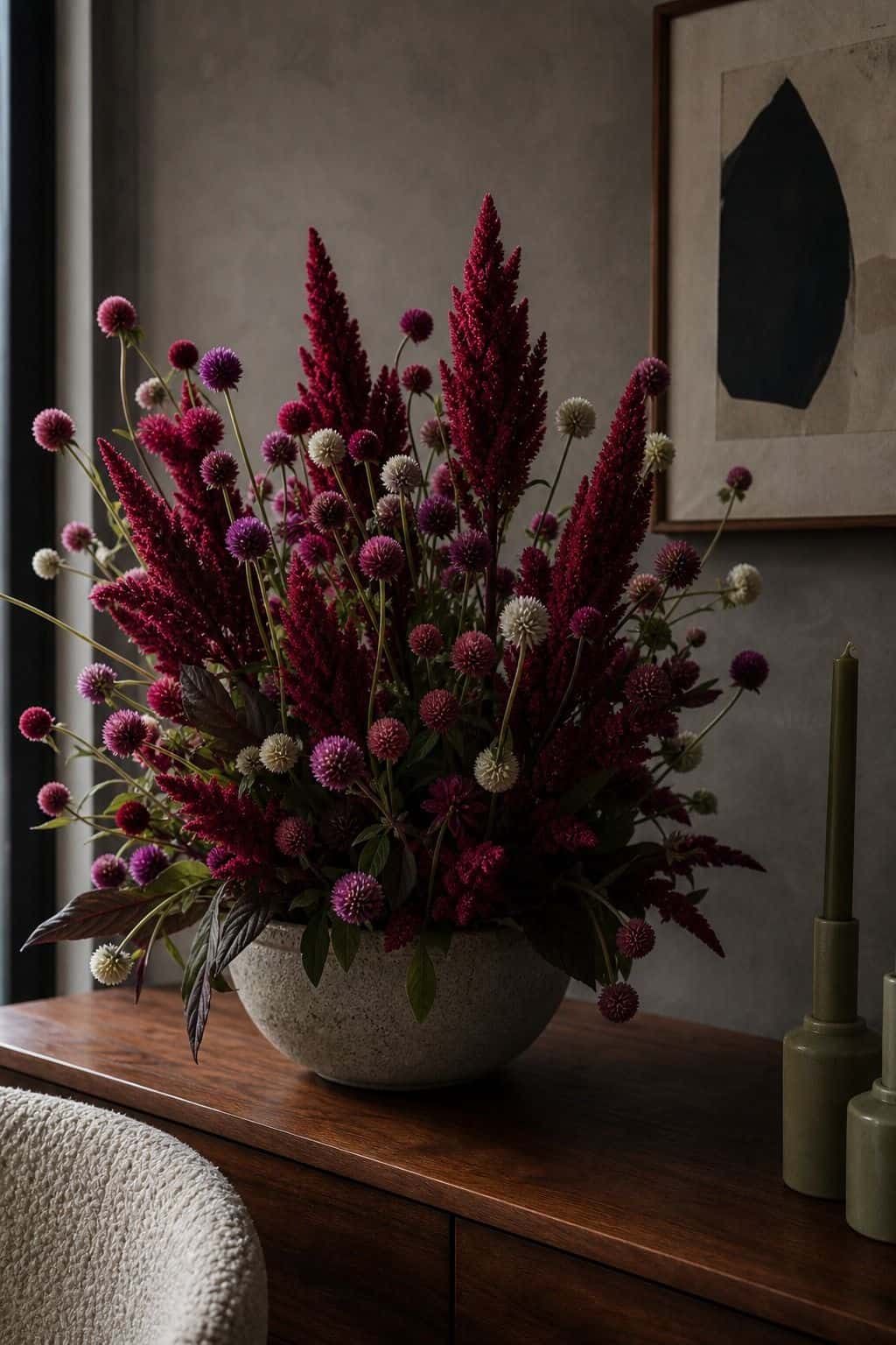 Burgundy celosia and globe amaranth in a textured summer wedding floral arrangement