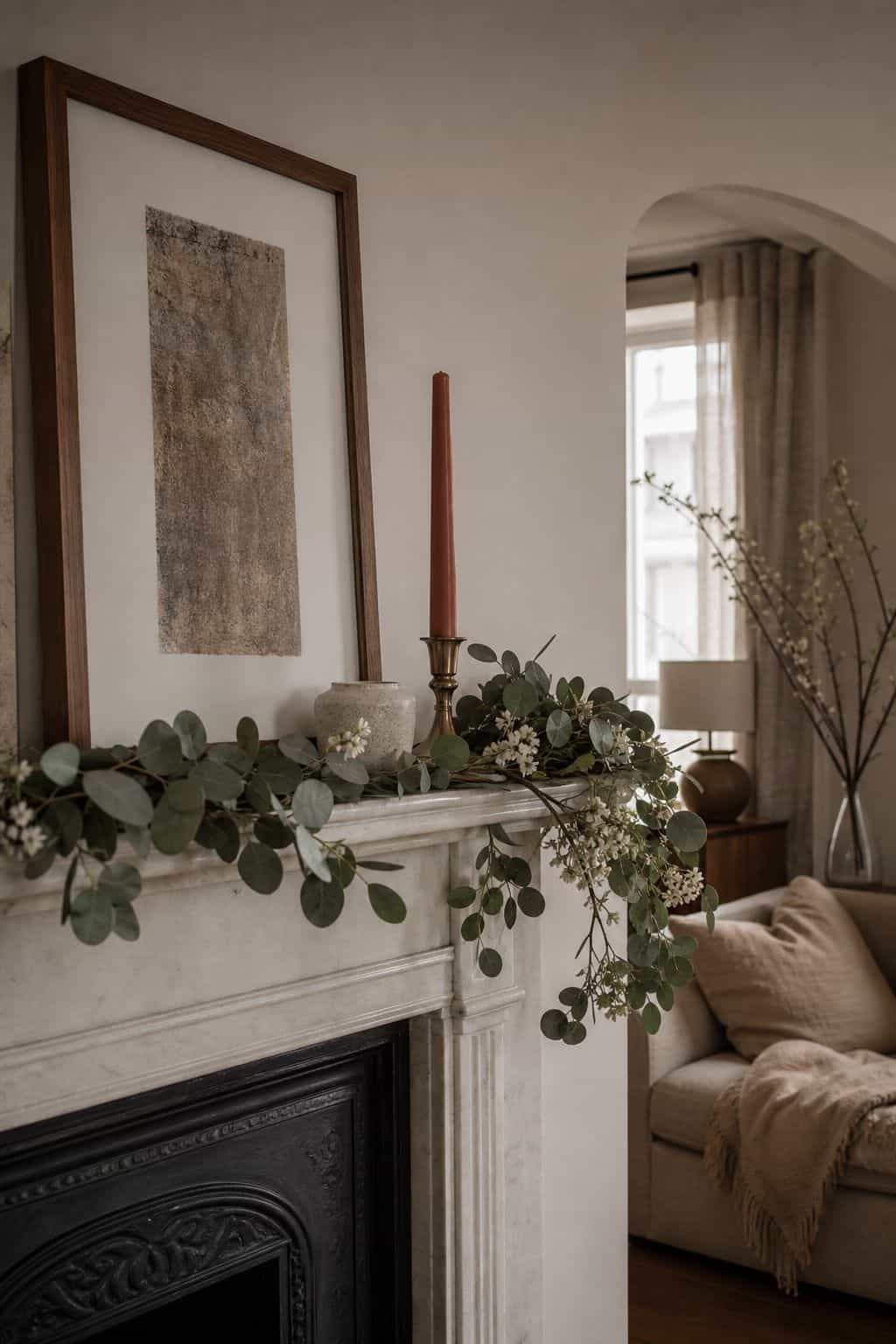 Soft Easter mantel garland with eucalyptus, taper candles, and neutral spring decor
