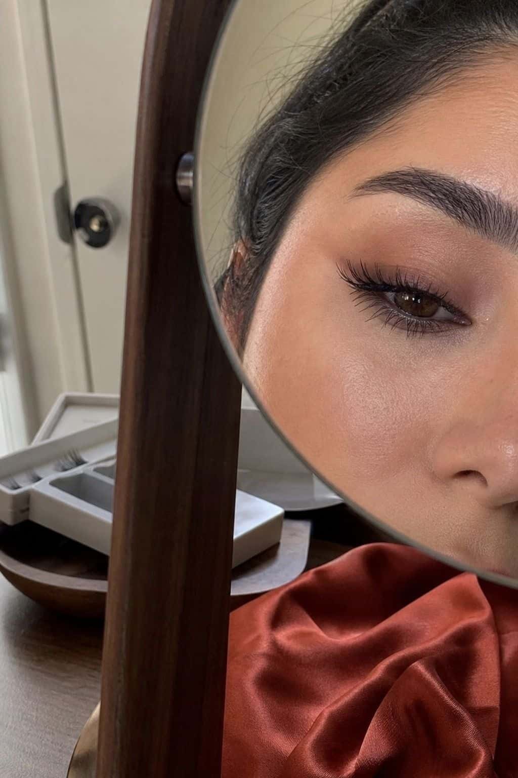 Long wispy strip lashes with soft graduation eye makeup