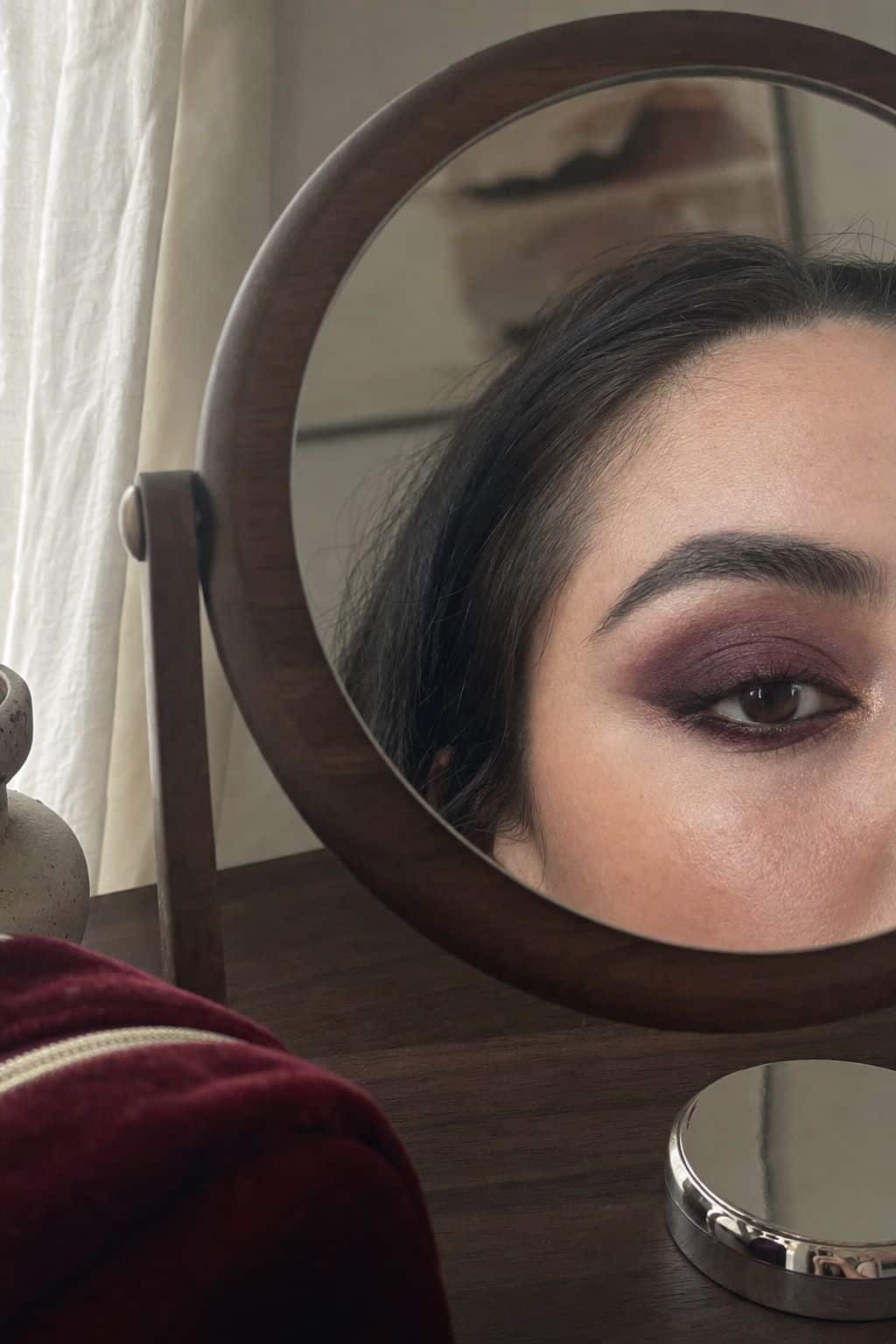 Smoky plum graduation eye makeup with dramatic jewel toned shadow