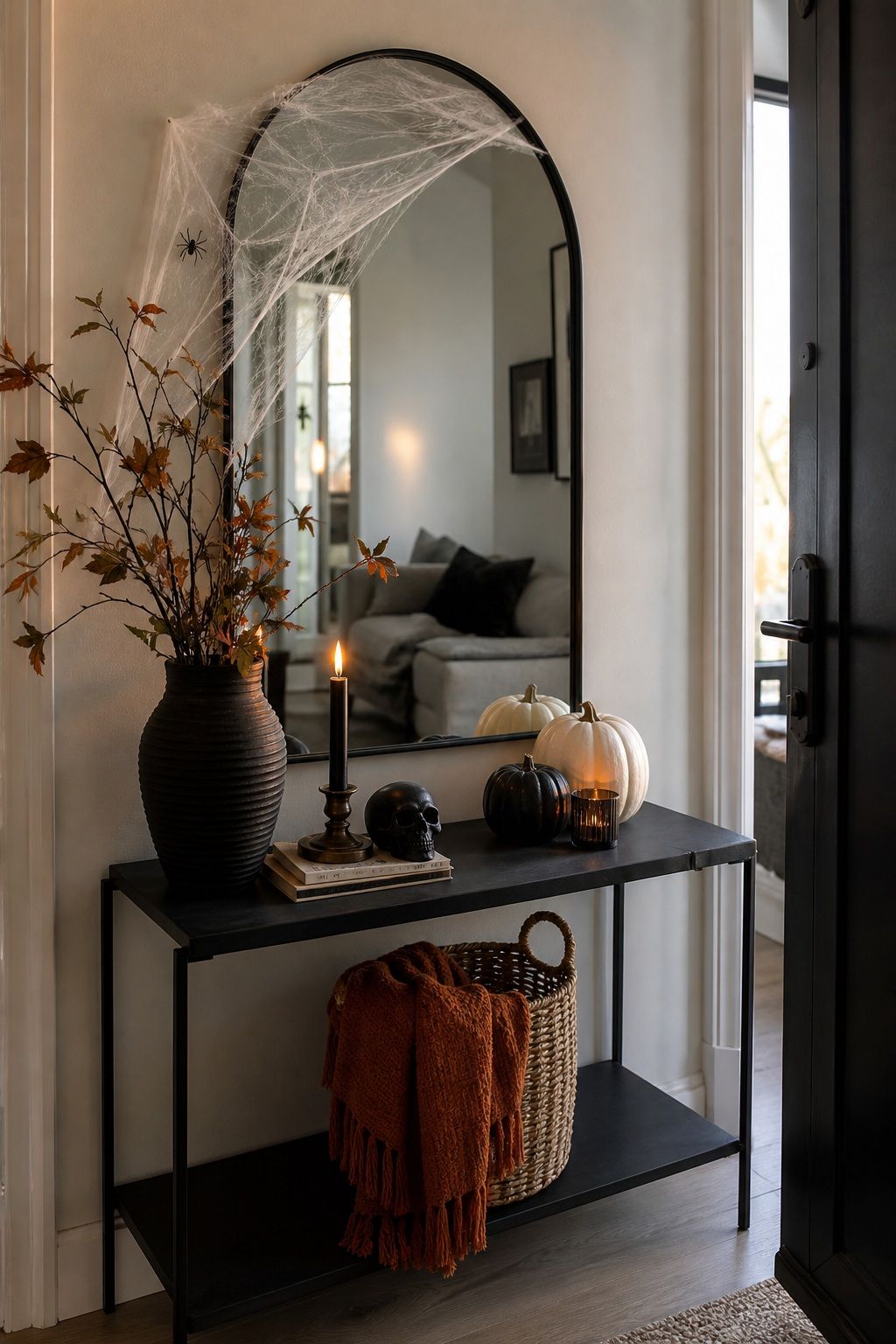 Drape the Mirror in Faux Cobwebs, Used Sparingly small apartment idea for Top 17 Halloween Entryway Decor Ideas for Apartments.