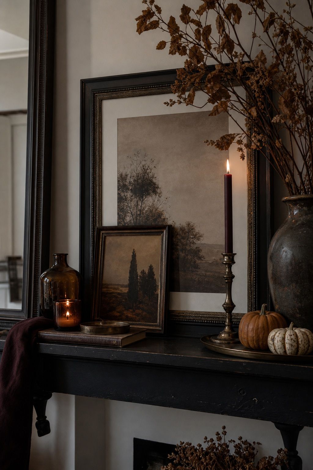 Style the Mantel as a Dark, Layered Vignette small apartment idea for Top 16 Moody Fall Decor Ideas for Small Apartments.
