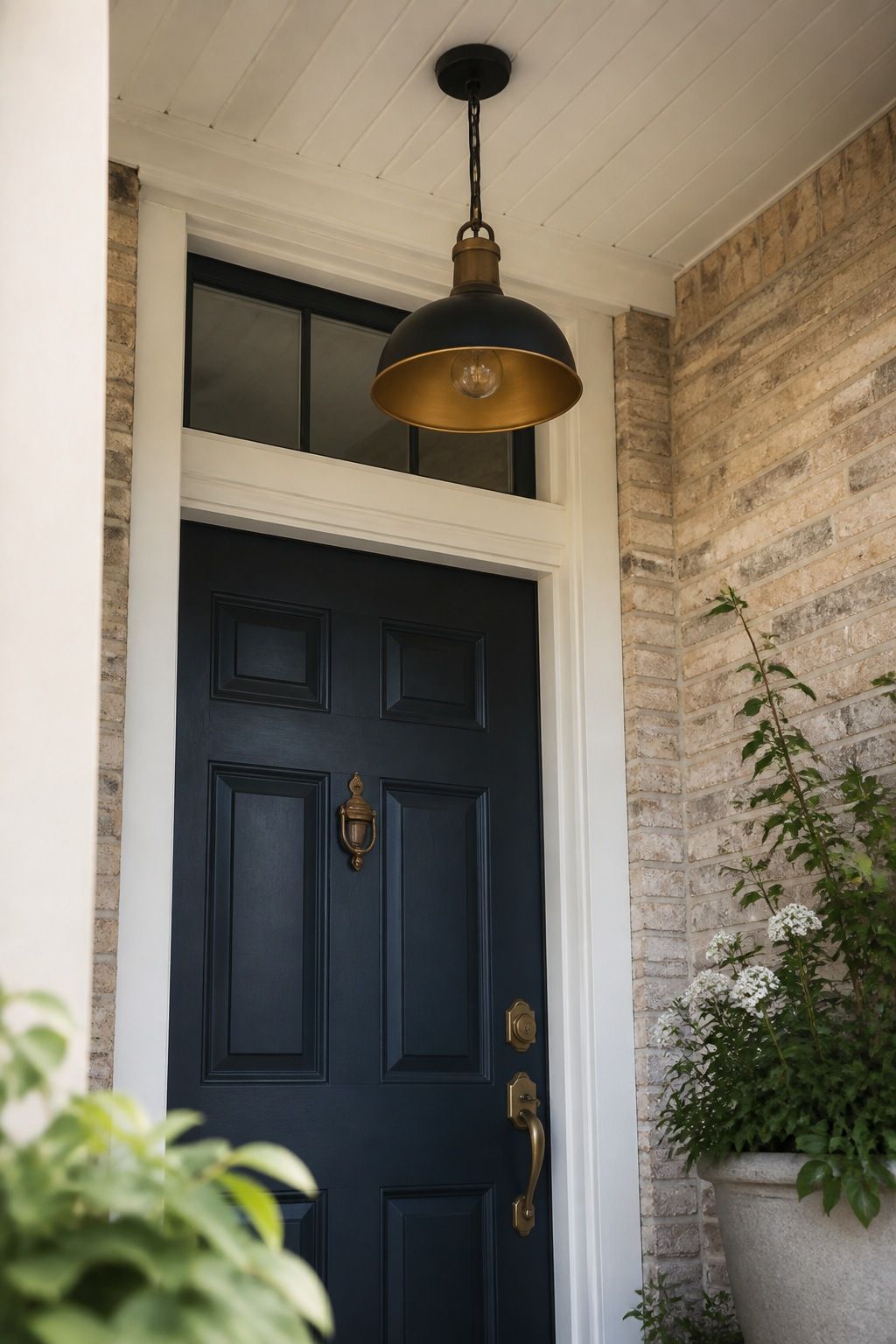 Install a Pendant Light Over the Door small apartment idea for Top 17 Summer Front Porch Decorating Ideas for Apartments and Small Outdoor Spaces.