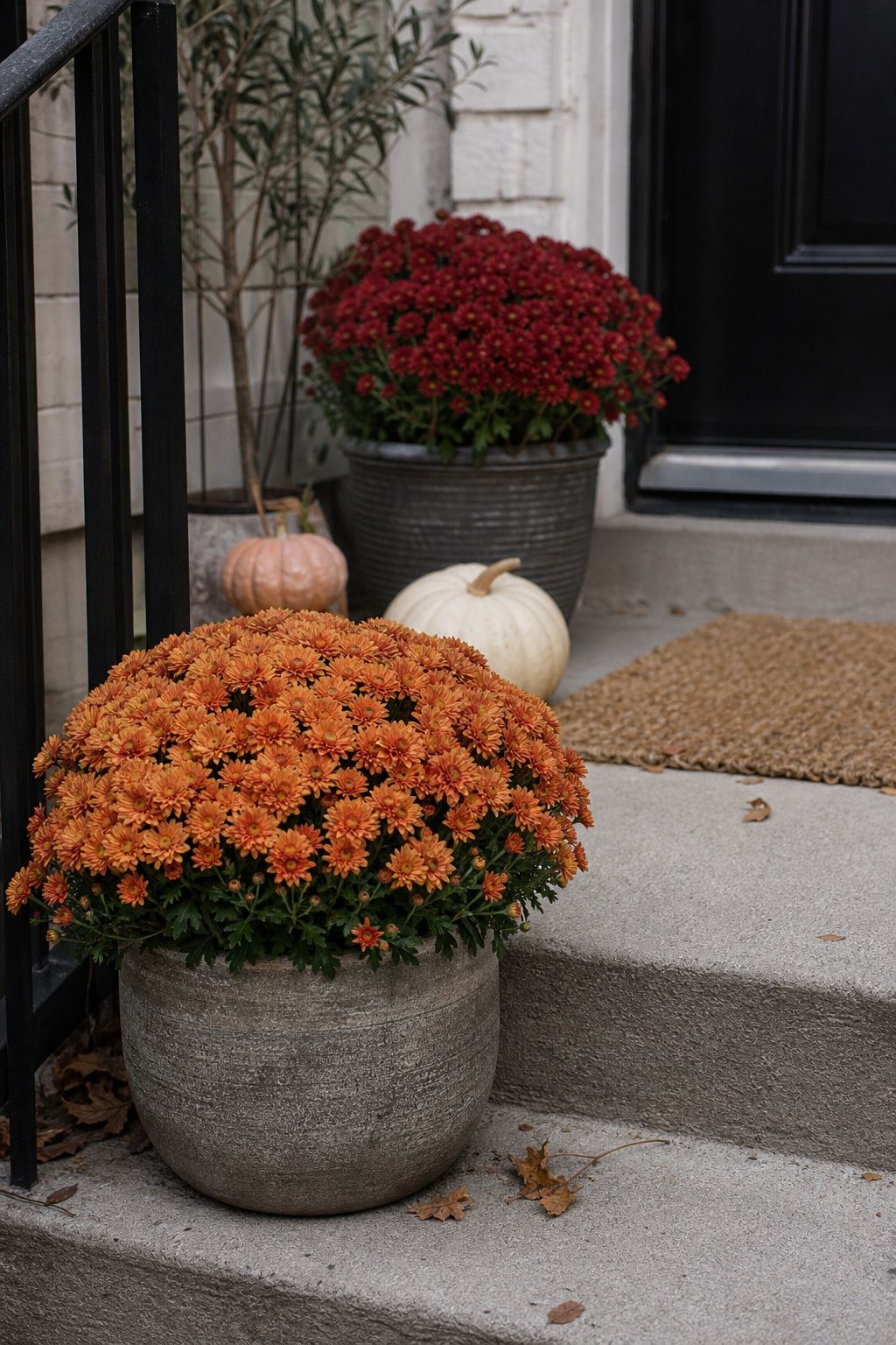 Fill Empty Planters With Fall-Hardy Mums small apartment idea for Top 17 Thanksgiving Front Porch Decor Ideas for Apartments and Small Outdoor Spaces.