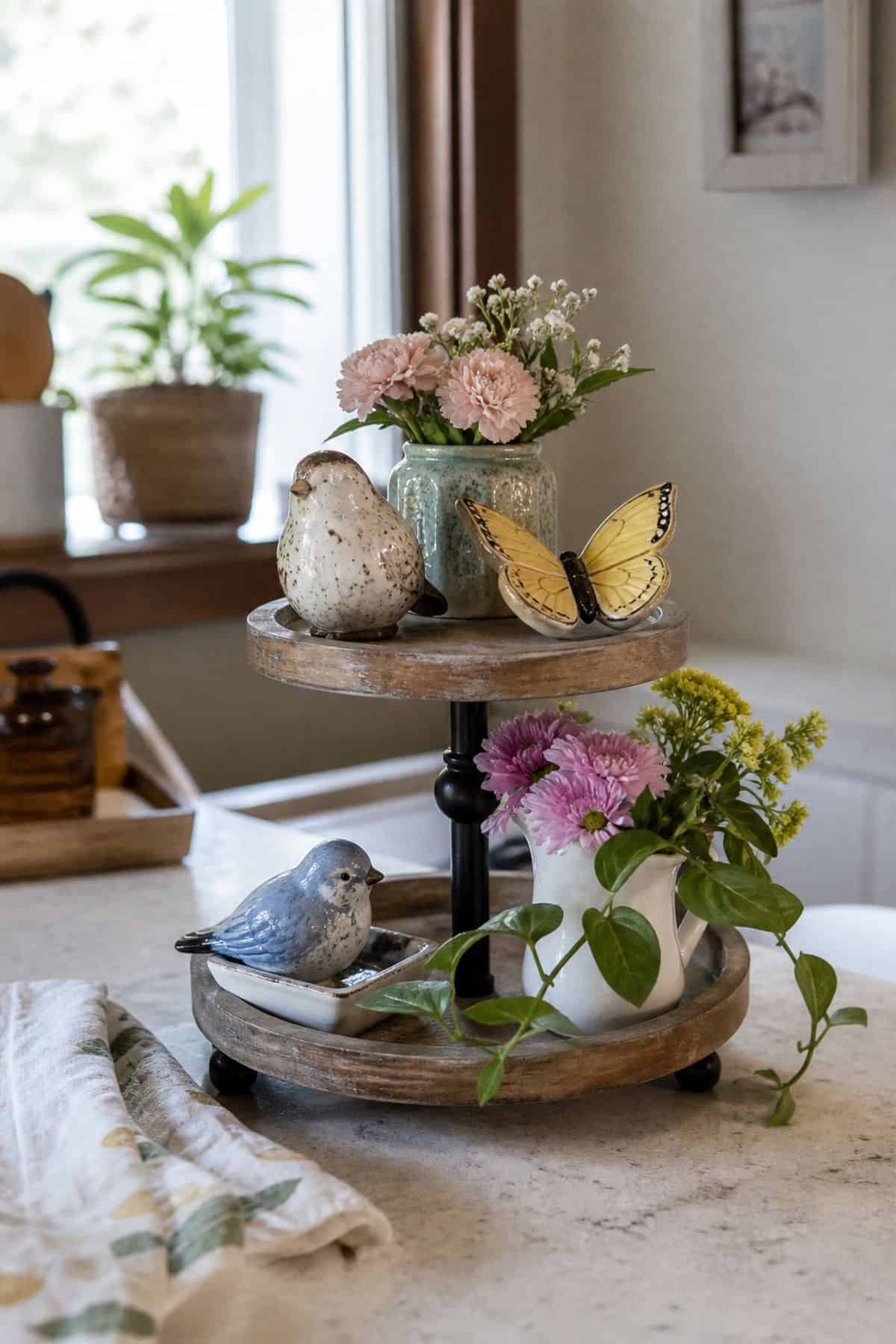 Add Colorful Ceramic Birds or Butterflies styled on a spring tiered tray in a small apartment